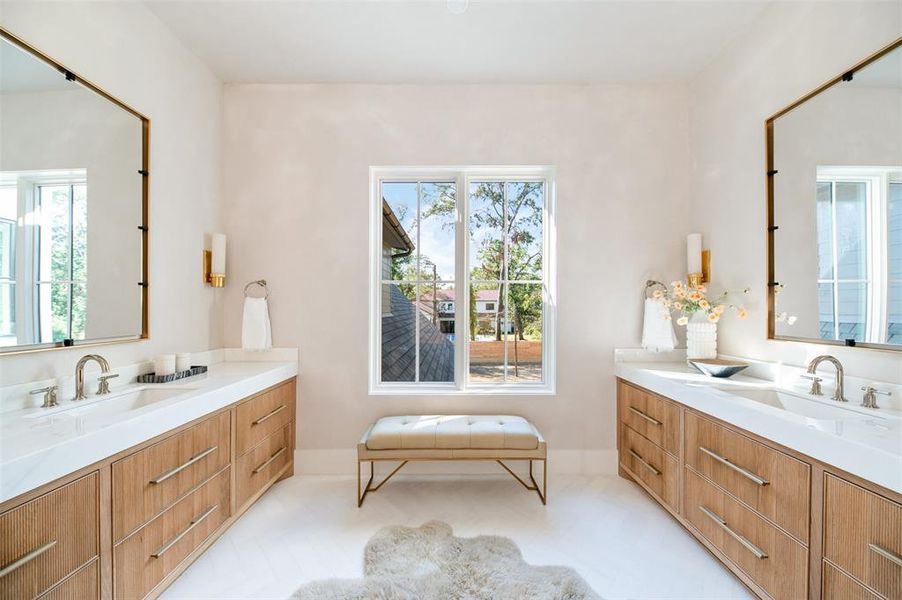 Dual vanity in this stunning primary bath!