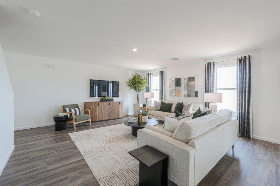 A living room with a couch and a table.