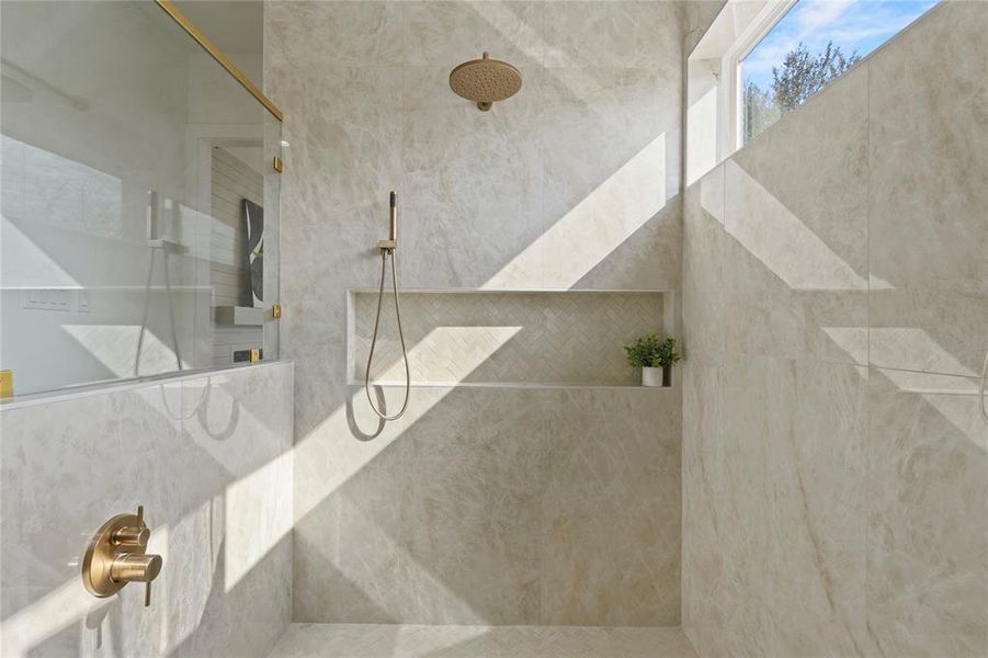 Full bathroom featuring a tile shower Full bathroom featuring a tile shower