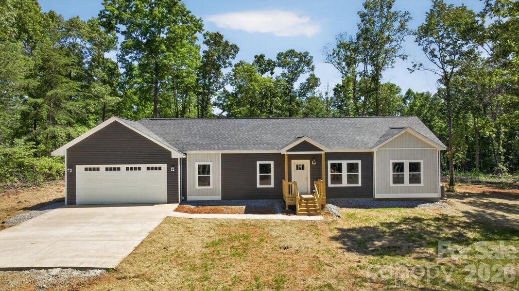 Front exterior of a new home in , Columbus, NC, highlighting curb appeal (Image 22).