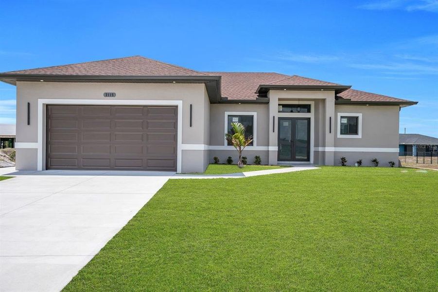 Front exterior of a new home in , Lehigh Acres, FL, highlighting curb appeal (Image 26).