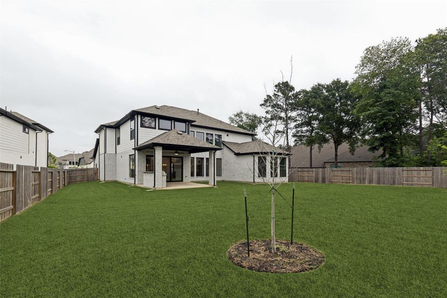 Exterior details and patio area of a home in , Conroe (Image 29).
