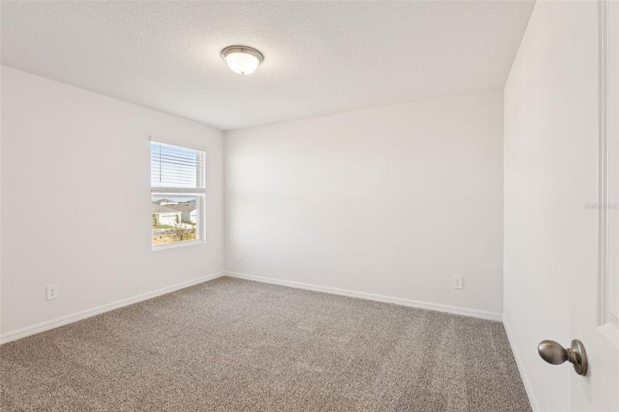 Spacious, unfurnished interior of a new home in The Reserve at Hammock Oaks - Classic Series, Lady Lake (Image 18).