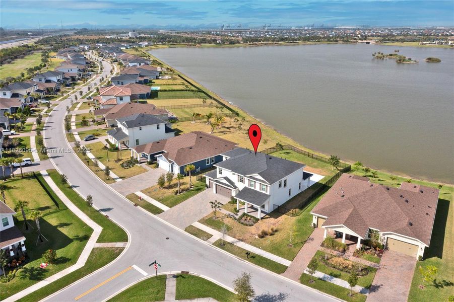 Front exterior of a new home in Arden: The Waterford Collection, Loxahatchee, FL, highlighting curb appeal (Image 28).