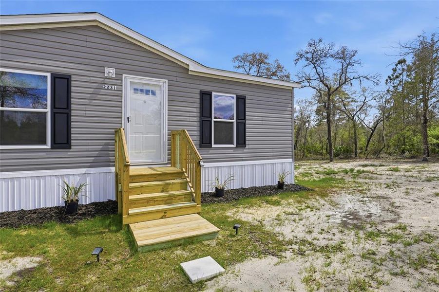Exterior details and patio area of a home in , Morriston (Image 22).