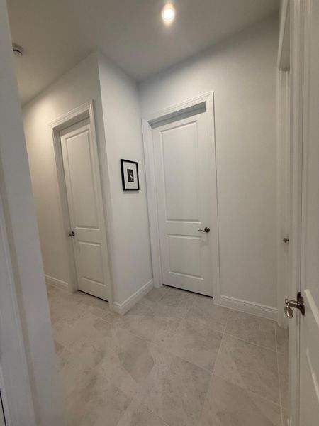 Hallway to Garage.Rooms.Guest Bathroom