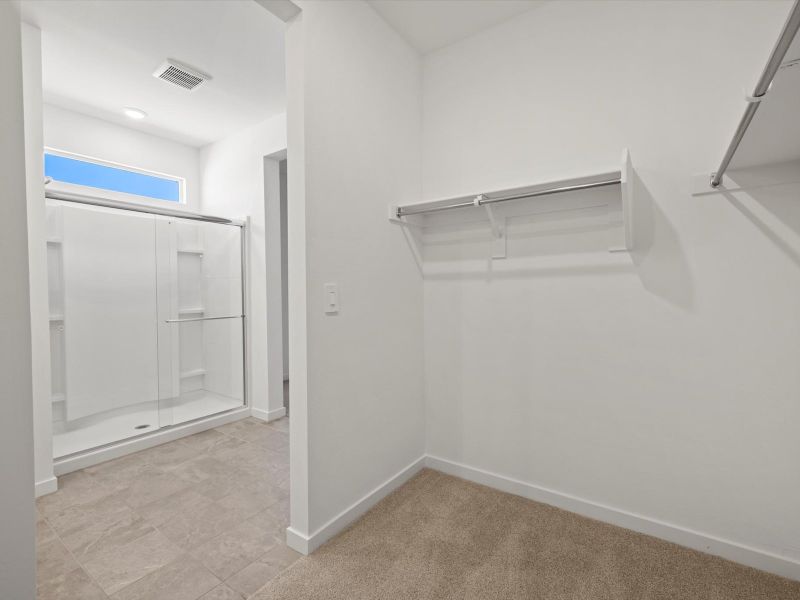Spacious, unfurnished interior of a new home in Rancho Mirage Estate Series, Maricopa (Image 13).