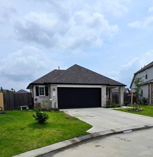 Front exterior of a new home in Granger Pines, Conroe, TX, highlighting curb appeal (Image 2). Front exterior of a new home in Granger Pines, Conroe, TX, highlighting curb appeal (Image 2).