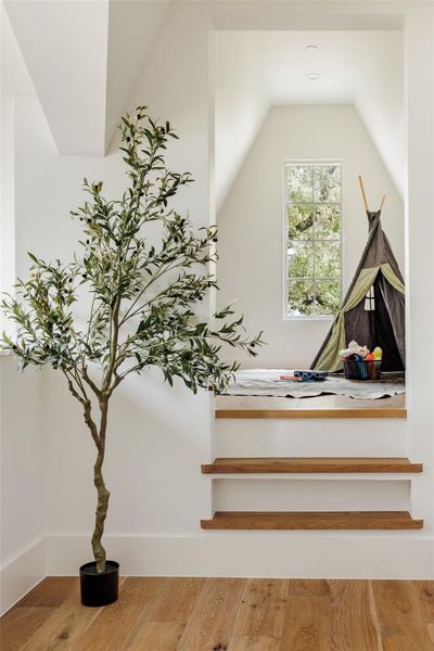 A sunlit alcove designed for quiet moments or creative play. Warm wood floors and architectural angles create a cozy hideaway that feels both whimsical and refined, proof that every corner of this home was crafted with lifestyle in mind. A sunlit alcove designed for quiet moments or creative play. Warm wood floors and architectural angles create a cozy hideaway that feels both whimsical and refined, proof that every corner of this home was crafted with lifestyle in mind.