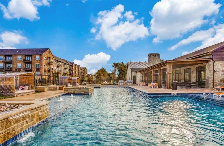 Community pool featuring cabana seating and a patio and dining area