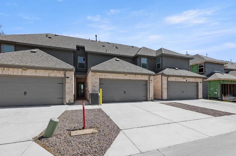 Front exterior of a new home in Timber Ridge, Corinth, TX, highlighting curb appeal (Image 7).