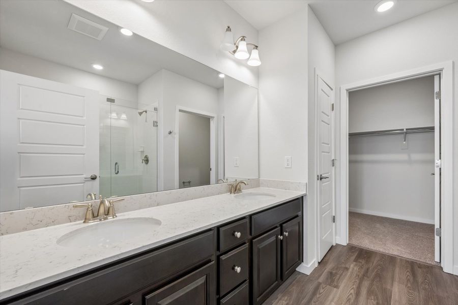 A bathroom with a large mirror.