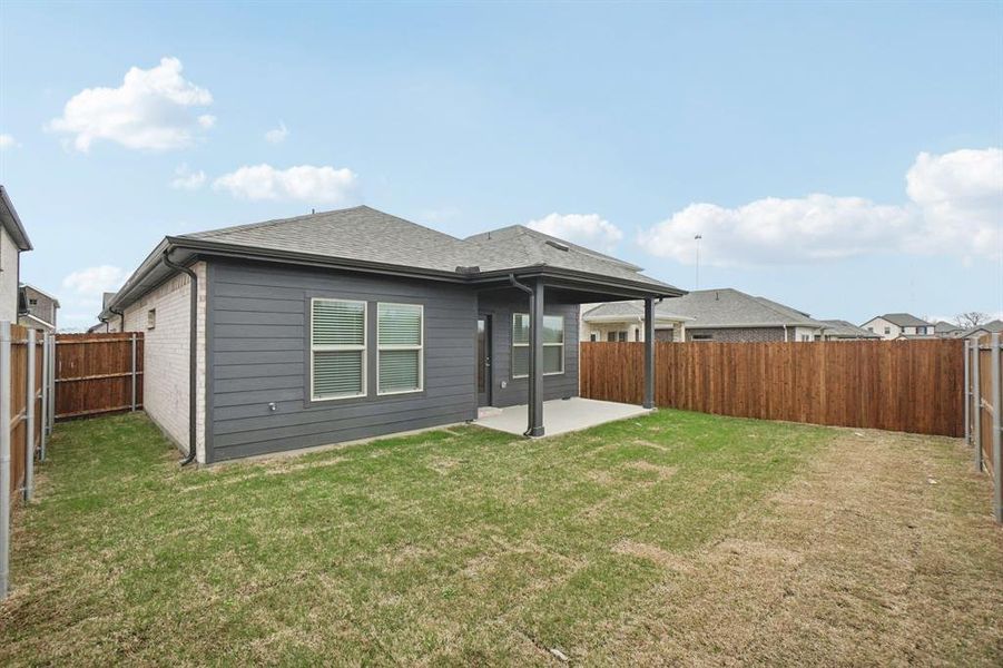 Exterior details and patio area of a home in Parks at Foster Crossing - Spring Series, Anna (Image 25).