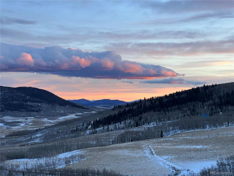 The rear elevation showcases the home's impressive scale and the walk-out potential of this sprawling, high-country lot. The rear elevation showcases the home's impressive scale and the walk-out potential of this sprawling, high-country lot.