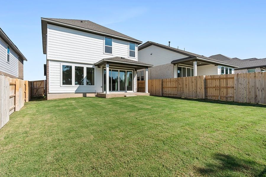 Exterior details and patio area of a home in Terrace Collection at Lariat, Liberty Hill (Image 24). Exterior details and patio area of a home in Terrace Collection at Lariat, Liberty Hill (Image 24).