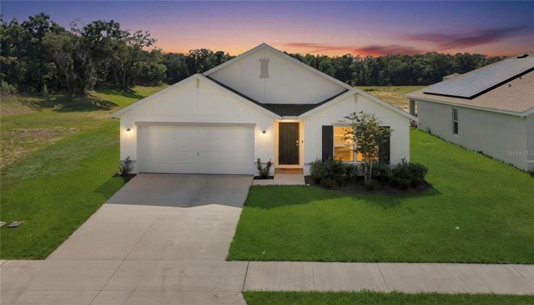 Front exterior of a new home in Autumn Glen, Belleview, FL, highlighting curb appeal (Image 23).