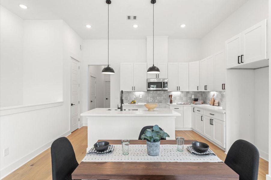 Adjacent dining area easily accommodates a full-size table, while the living space is inviting with cozy seating and access to a private balcony Adjacent dining area easily accommodates a full-size table, while the living space is inviting with cozy seating and access to a private balcony