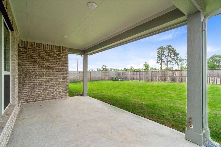 Step outside to back patio and spacious back green space.