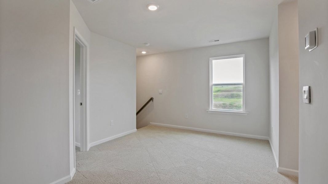 Spacious, unfurnished interior of a new home in The Grove at Matthews Landing, Fuquay Varina (Image 19).