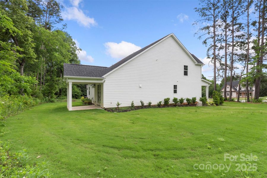 Exterior details and patio area of a home in Crescent Golf, Salisbury (Image 29).