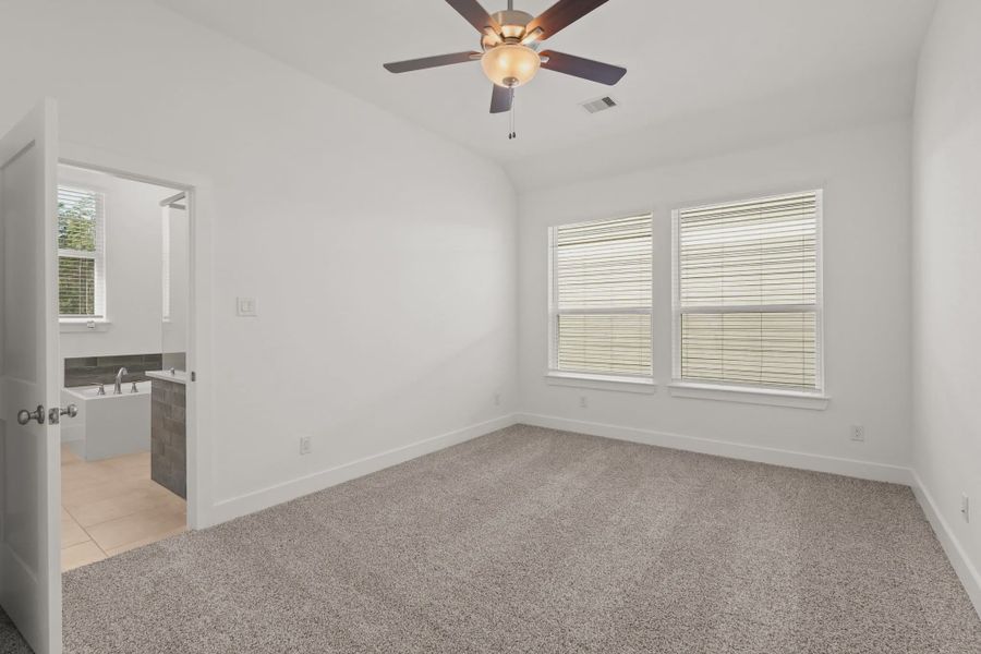 Representative unfurnished interior of a home built from the Cheverny by Chesmar Homes in Santa Rita Ranch, Liberty Hill (Image 12).