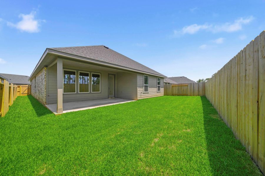 Exterior details and patio area of a home in Mill Creek Estates, Magnolia (Image 4).