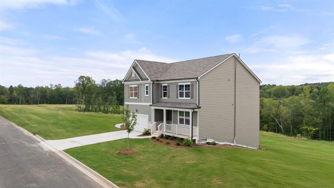 Front exterior of a new home in Sheffield Highlands, Dallas, GA, highlighting curb appeal (Image 22).