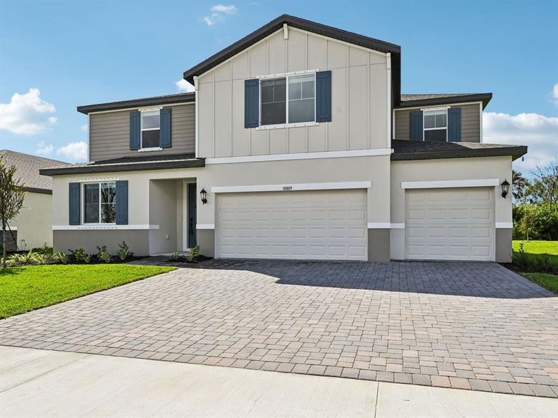 Front exterior of a new home in Oakfield Trails - Premier Series, Parrish, FL, highlighting curb appeal (Image 2).