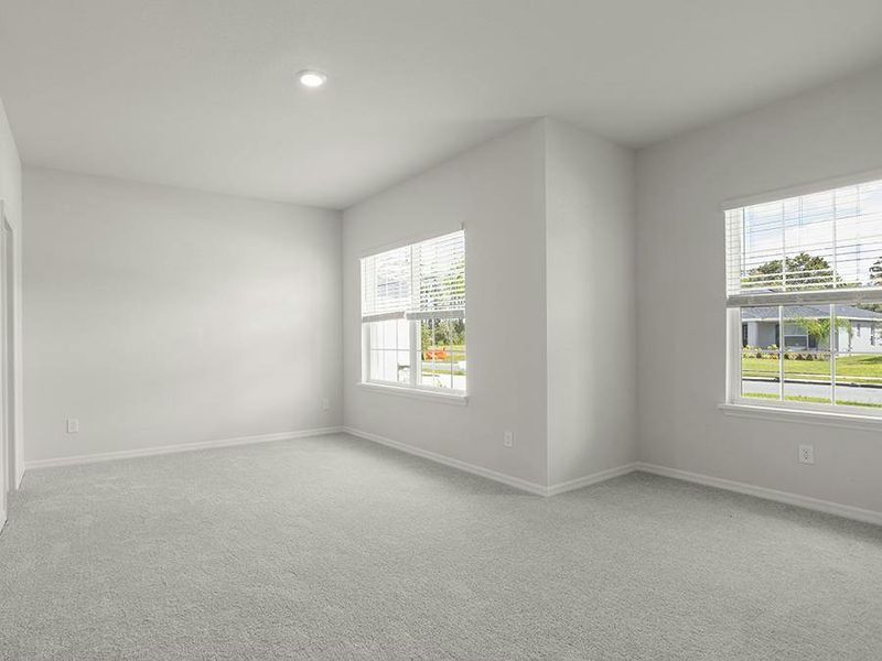 The bedroom 3 suite, at the front of the home, features spacious dimensions and natural lighting - Everly by Highland Homes