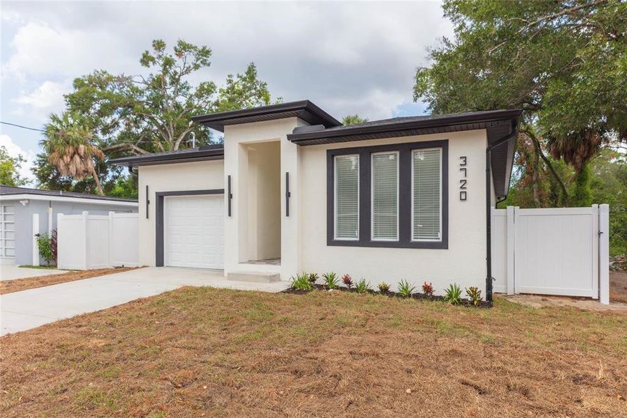 Front exterior of a new home in , Tampa, FL, highlighting curb appeal (Image 22). Front exterior of a new home in , Tampa, FL, highlighting curb appeal (Image 22).