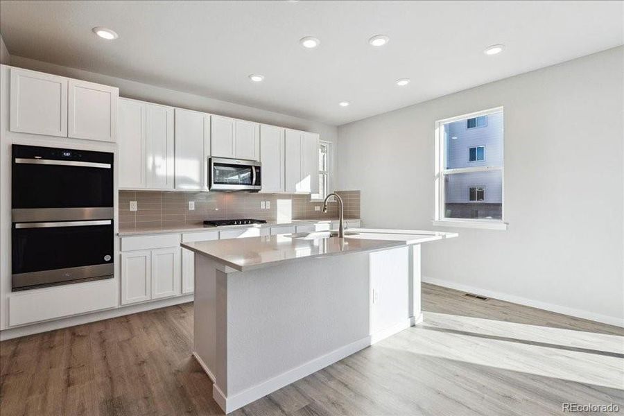 Furnished interior view inside a new home in Floret Collection at Alder Creek, Parker (Image 4). Furnished interior view inside a new home in Floret Collection at Alder Creek, Parker (Image 4).