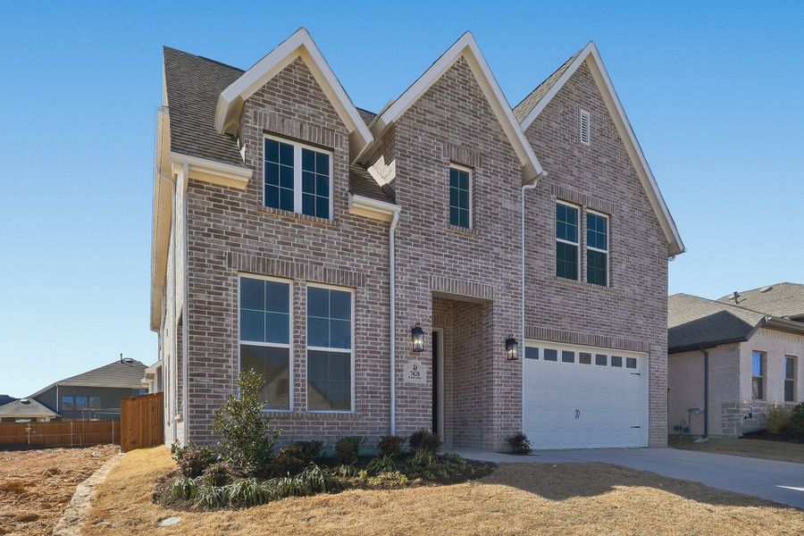 Front exterior of a new home in Tavolo Park, Fort Worth, TX, highlighting curb appeal (Image 27).