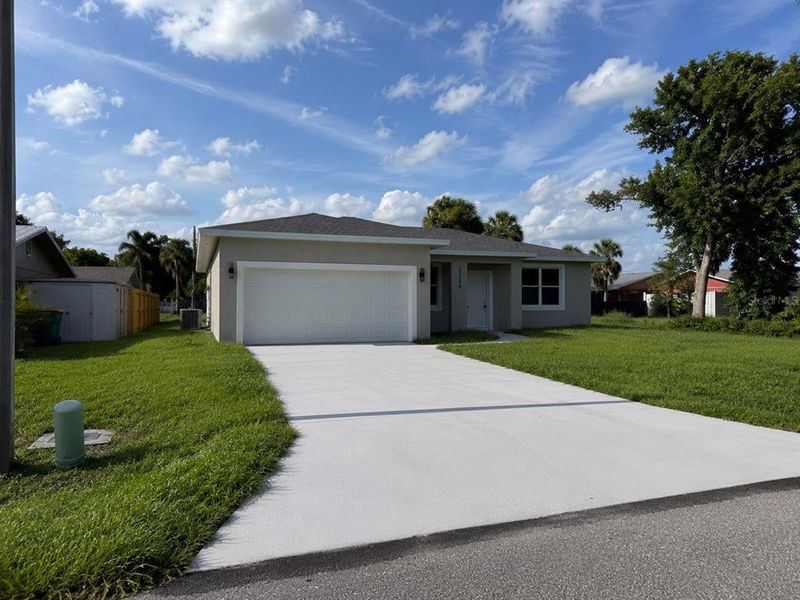 Front exterior of a new home in , Port Charlotte, FL, highlighting curb appeal (Image 23). Front exterior of a new home in , Port Charlotte, FL, highlighting curb appeal (Image 23).