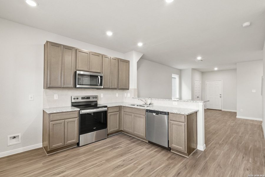 Furnished interior view inside a new home in Abbott Place, St. Hedwig (Image 8).
