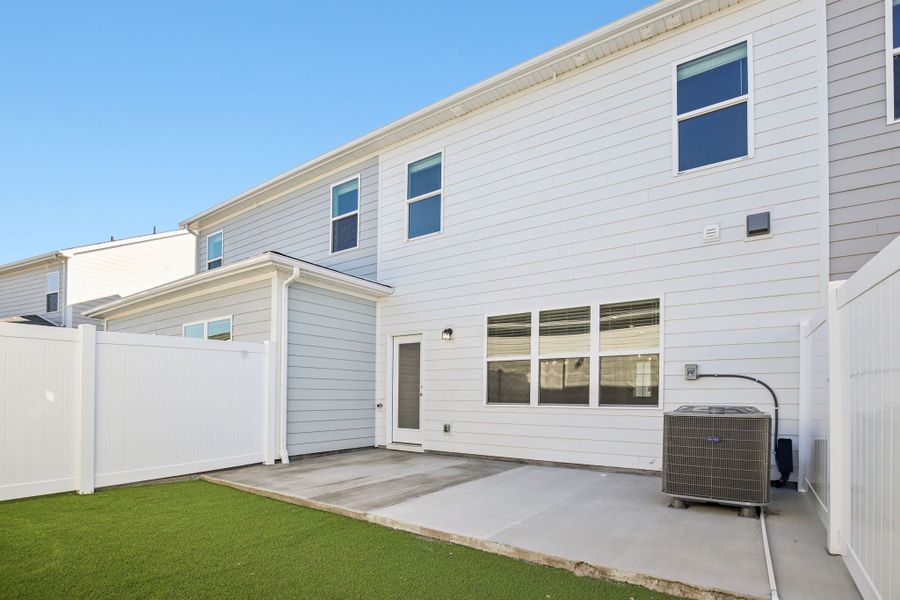 Exterior details and patio area of a home in Greystone - Vista Townhomes, Smyrna (Image 4).