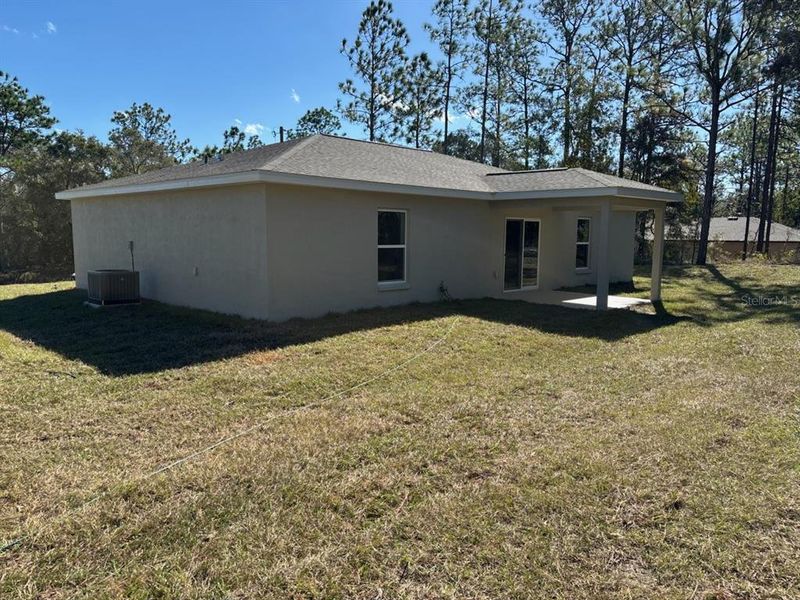 Exterior details and patio area of a home in , Citrus Springs (Image 20).