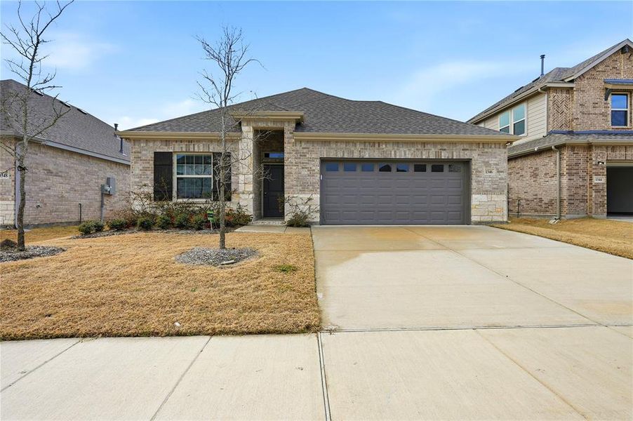 Front exterior of a new home in , Forney, TX, highlighting curb appeal (Image 2). Front exterior of a new home in , Forney, TX, highlighting curb appeal (Image 2).