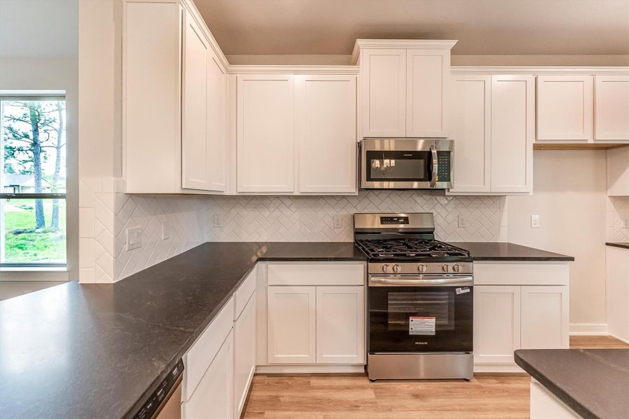 Furnished interior view inside a new home in Deer Pines, Conroe (Image 8).