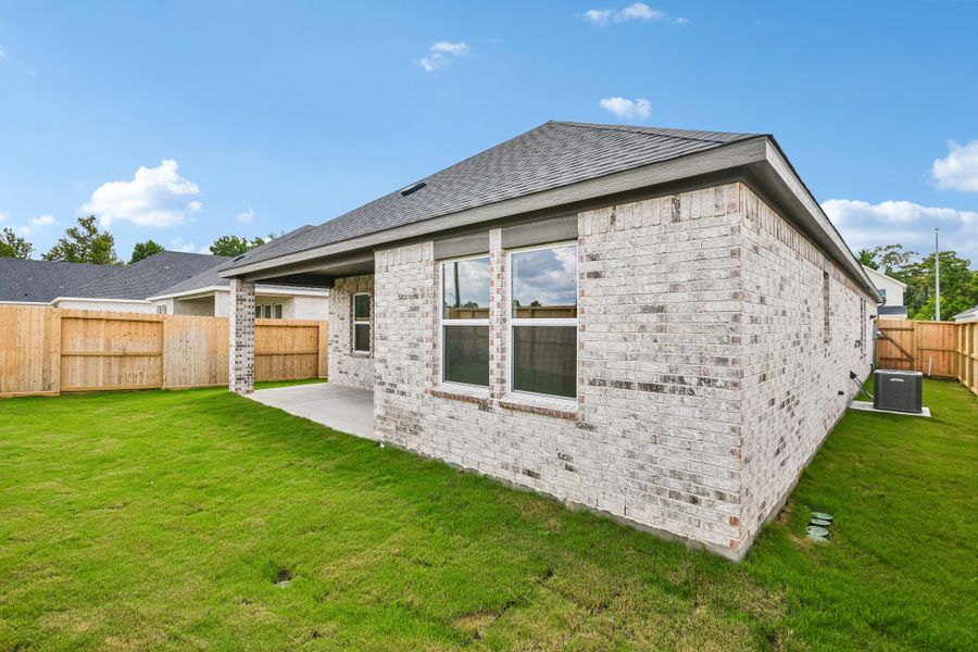 Exterior details and patio area of a home in Raburn Reserve 50s, Tomball (Image 20).