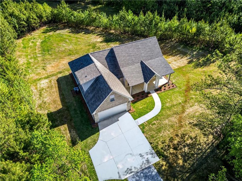 Front exterior of a new home in , Locust Grove, GA, highlighting curb appeal (Image 25).