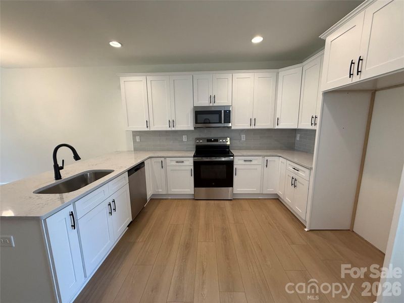 ...quartz countertops, high end cabinetry,...