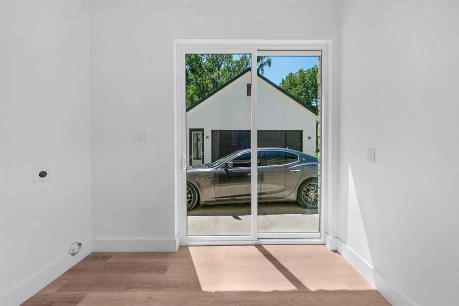 Entry featuring baseboards and wood finished floors Entry featuring baseboards and wood finished floors