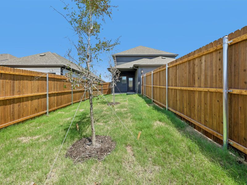 Exterior details and patio area of a home in Cibolo Hills West - Spring Series, Fort Worth (Image 3).