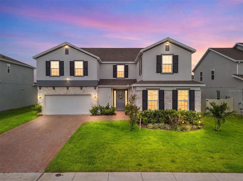 Front exterior of a new home in , Minneola, FL, highlighting curb appeal (Image 30). Front exterior of a new home in , Minneola, FL, highlighting curb appeal (Image 30).