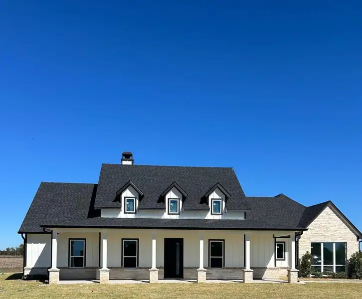 Front exterior of a new home in , Sealy, TX, highlighting curb appeal (Image 1). Front exterior of a new home in , Sealy, TX, highlighting curb appeal (Image 1).