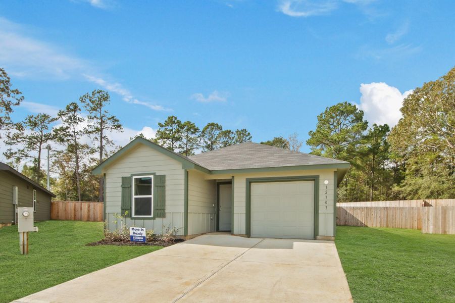 Front exterior of a new home in McCrorey Trails, Conroe, TX, highlighting curb appeal (Image 1).