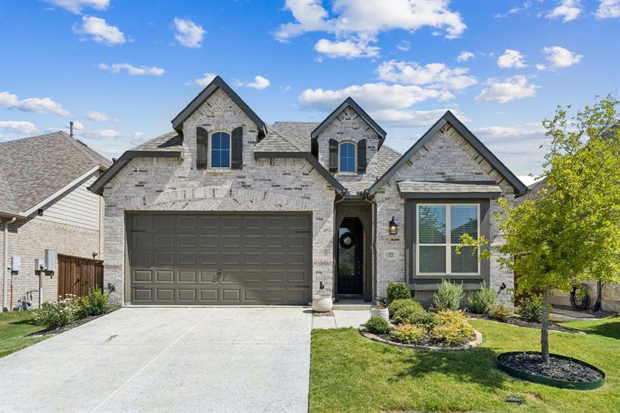 Front exterior of a new home in , Aubrey, TX, highlighting curb appeal (Image 20). Front exterior of a new home in , Aubrey, TX, highlighting curb appeal (Image 20).