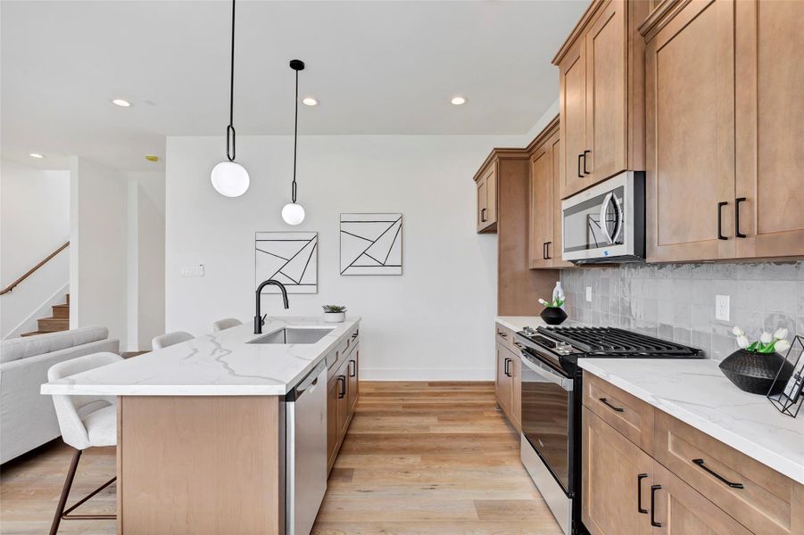 The elegant cabinetry that beautifully complements the rich tones of the flooring, creating a cohesive and warm aesthetic throughout the kitchen. The elegant cabinetry that beautifully complements the rich tones of the flooring, creating a cohesive and warm aesthetic throughout the kitchen.