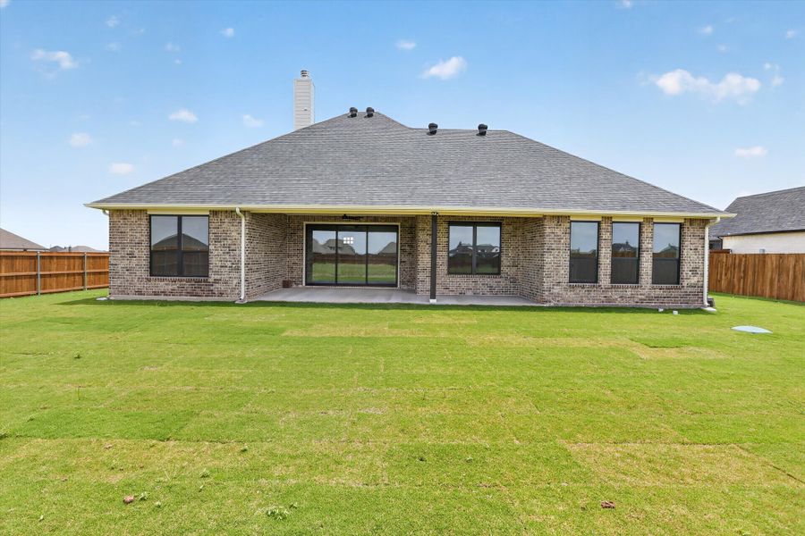 Front exterior of a new home in Coyote Crossing, Godley, TX, highlighting curb appeal (Image 27).