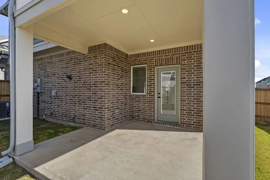 Exterior details and patio area of a home in Meridiana, Manvel (Image 3).